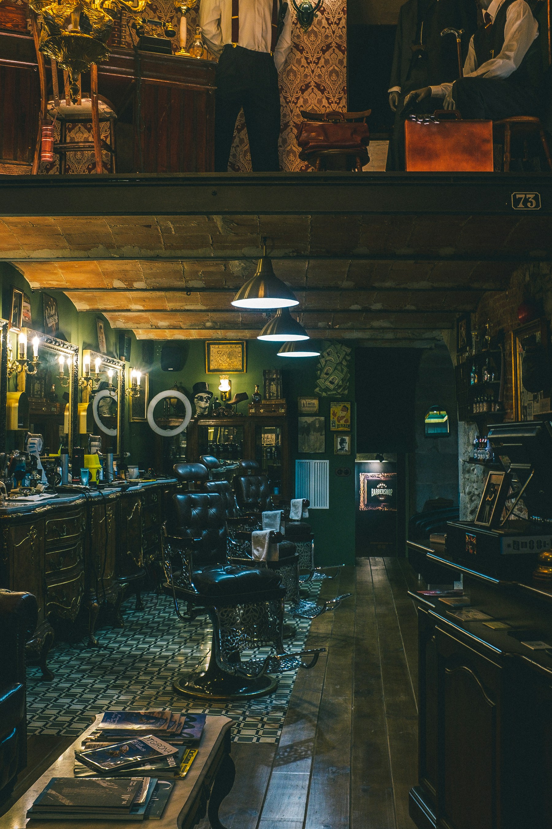 A warmly lit barbershop interior with classic chairs